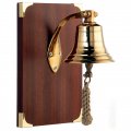 Heavy bell fixated on wooden board Heavy bell fixated on wooden board